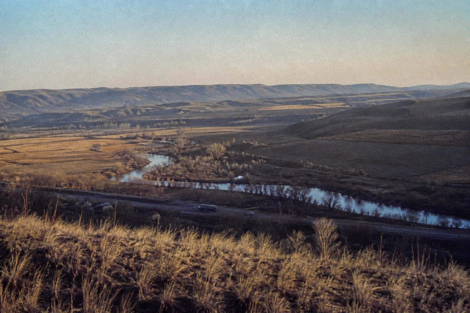 Bare orchards and a winding river in the winter Yakima Valley.